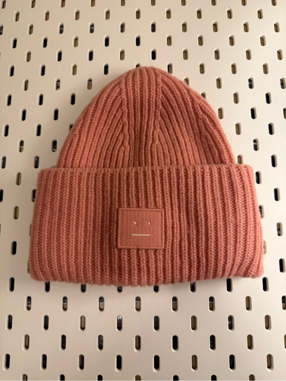 Acne Studios large face logo beanie in Peach / pansy color